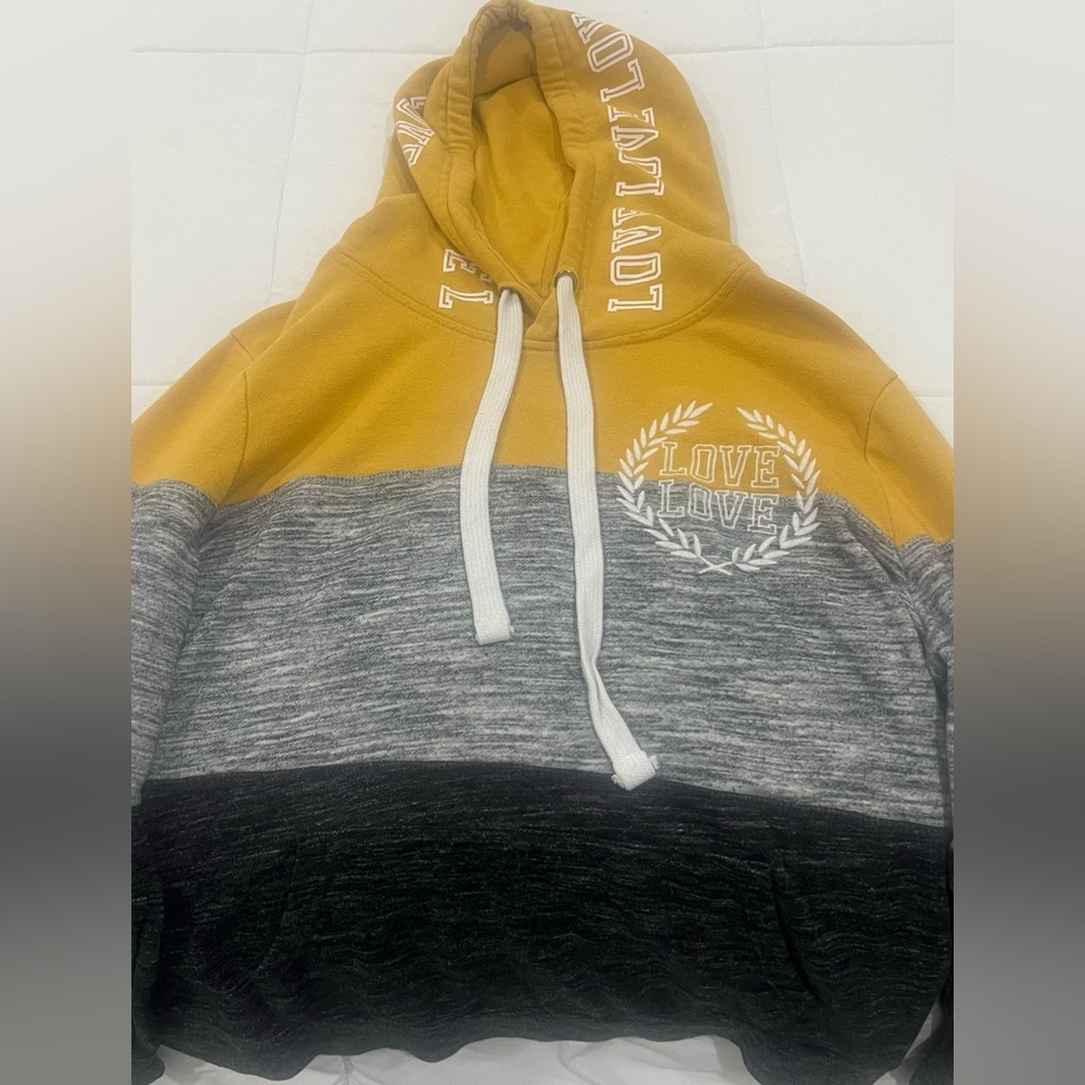 Yellow LOVE sweater.